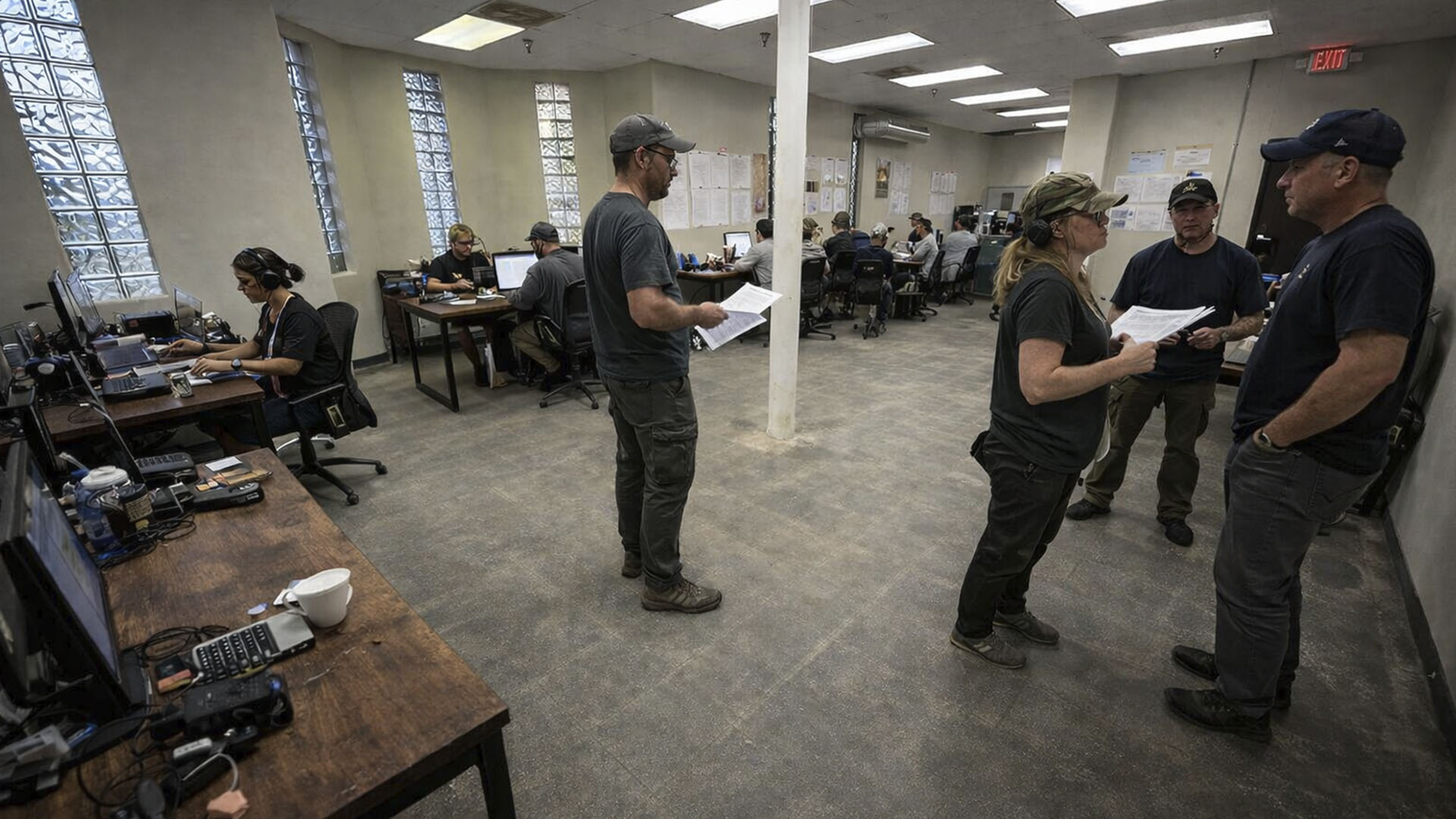 Production crew working in bullpen office space at AKS Stages